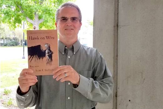 scott starbuck with his book hawk on wire