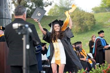 student walking across stage